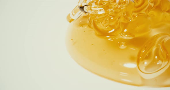 Pouring Golden Honey on the Plate