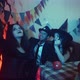 A Group of Friends are Sitting at a Table in Creepy Costumes Taking Pictures on Their Phone and - VideoHive Item for Sale
