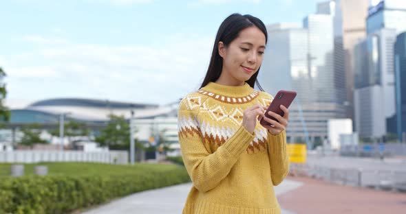 Woman use of cellphone in city