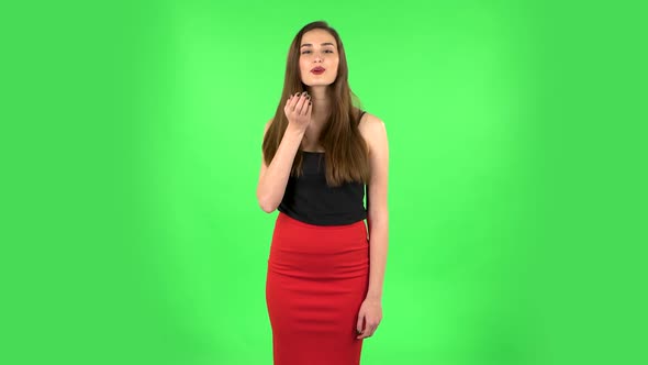Cute Girl Smiles and Showing Blowing Kiss. Green Screen