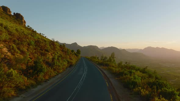 Car Driving on Road in Mountains