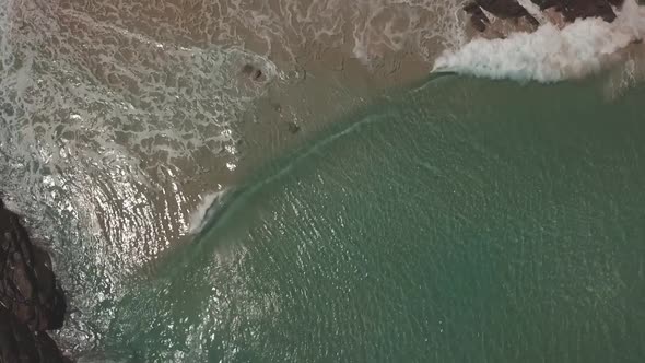 Ocean waves crashing onto an empty beach in Western Australia