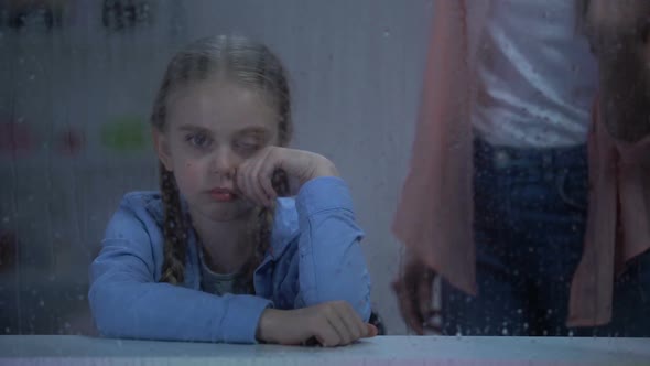 Mother Screaming on Naughty Little Girl Behind Rainy Window, Problem Child