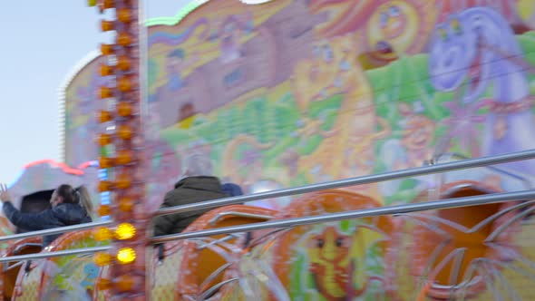 Slowmotion of People Starting a Ride in Elnuevo Dinosauri Attraction Roller Coaster Train at