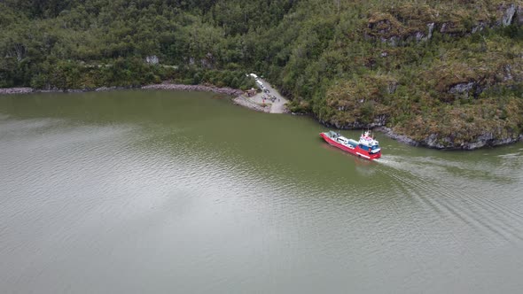 Cars transported by ferry on Carretera Austral, Chile. Top view of aerial drone ferry.