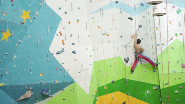 Climbing on artificial wall indoors