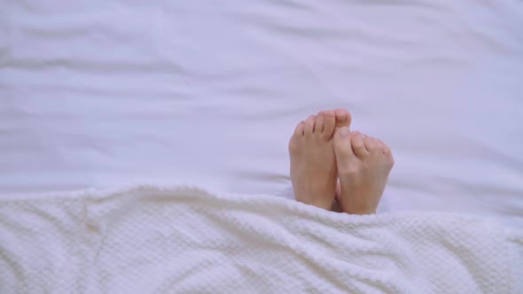 Close Up Caucasian Woman Feet in Bedroom