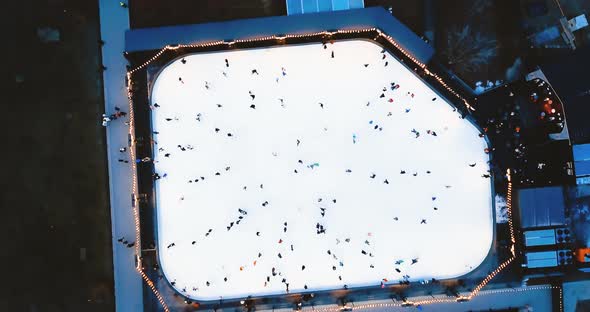 Skating Rink on the Street. People Ride on the Ice. New Holland Island in St. Petersburg. Aerial Top