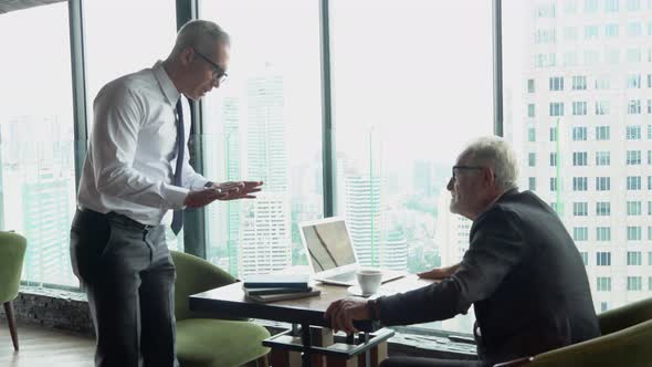 Senior manager checking time wait appointments employee with schedule.