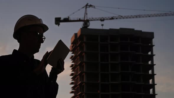 Construction Manager Using Tablet on Building Site