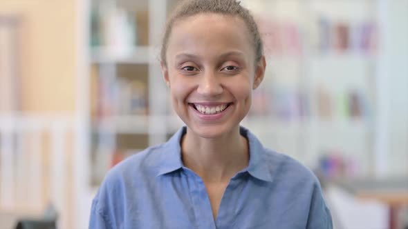 Portrait of Smiling African Woman Looking at Camera