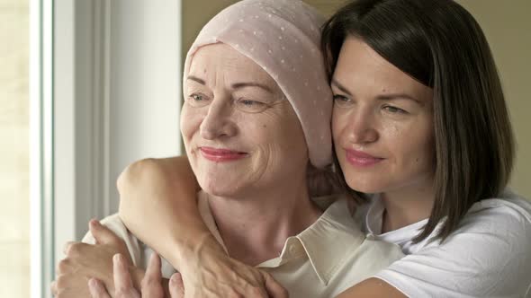 Young Woman Hugs Her Sick Mom After Chemotherapy