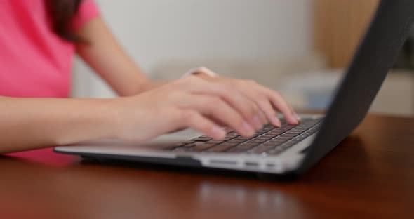 Woman type on the laptop computer