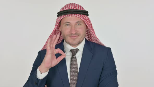 Arab Businessman showing Ok Sign with Finger, White Background