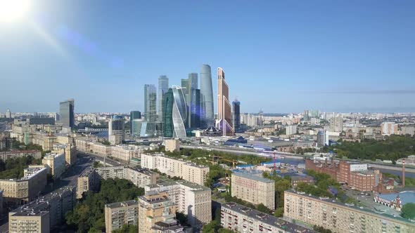 Aerial View of Drone Moscow City Skyscrapers Through Sun Rays. Business Center of Moscow-city