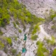 Flight Over a Mountain River and a Trail to a Gorge Among a Coniferous Forest - VideoHive Item for Sale