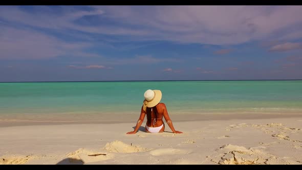 Single lady tans on relaxing resort beach time by turquoise water and white sand background of the M
