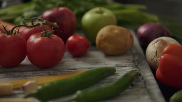 Anonymous Person Taking Tomatoes From Table