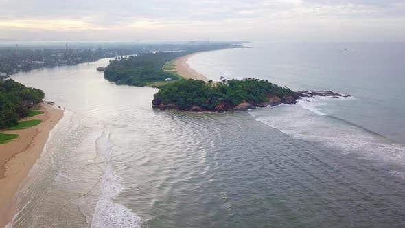 Aerial top view ocean waves. Sea waves on the dangerous stones