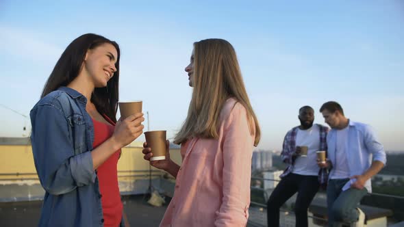 Cheerful Women Talking and Laughing, Spending Time Together at Roof Party