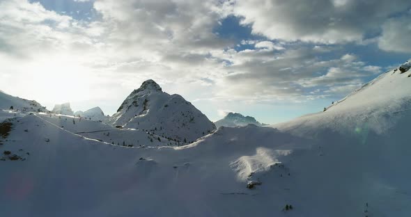 Backward Aerial From Snowy Mounts at Valparola Pass