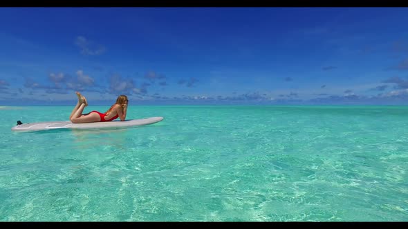 Two lovers engaged on tropical sea view beach time by blue water with white sandy background of the 