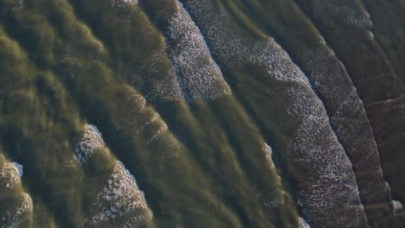 Top View of Texture Waves Sandy Beach