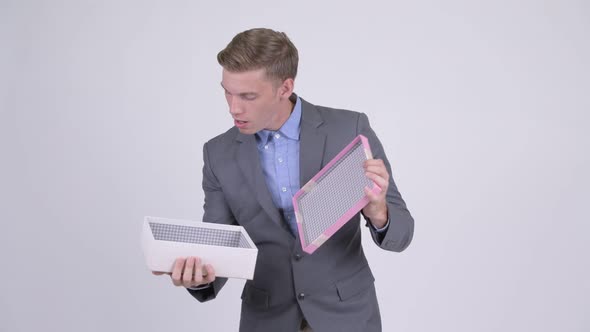 Young Businessman Opening Empty Gift Box