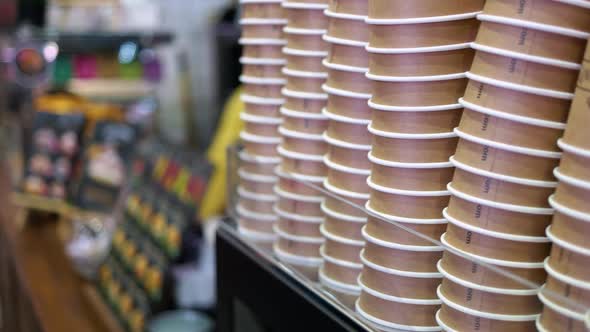 Checkout Counter and Stacks of Disposable Cups