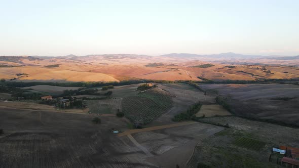 Aerial view of Val d'Orcia countryside landscape in Tuscany, Italy.