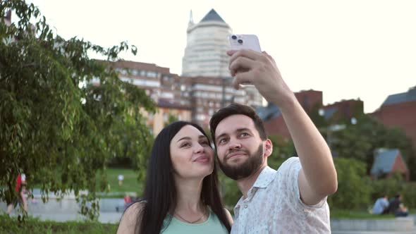 Couple in Love Taking a Selfie in the Park 