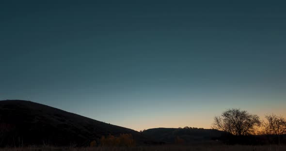 Mountain Meadow Timelapse at the Summer or Autumn Sunrise Time