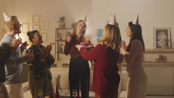 Woman Celebrating Birthday with Group of Friends