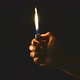 hand hold a burning lighter in the dark - VideoHive Item for Sale