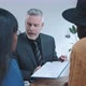 Multi ethnic couple discussing contract with sales agent - VideoHive Item for Sale
