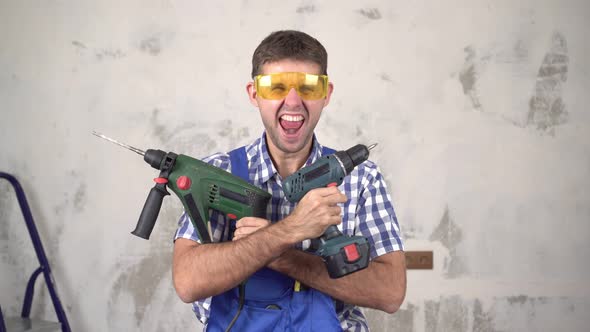 Emotional Crazy Male Builder or Worker with Construction Tools