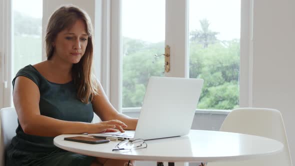 Millennial female professional working in a creative office