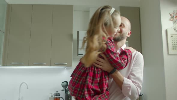 Loving Father Spinning Laughing Daugther at Home