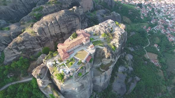 Drone view of Holy Trinity Monastery and Meteora rocks in Greece