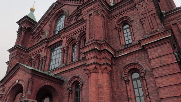 Uspenski orthodox cathedral in Helsinki, dolly out, shot from the ground looking up during an overca