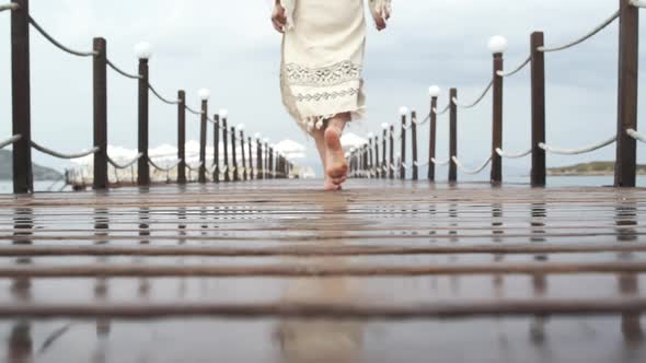 Woman Walking Wooden Pier