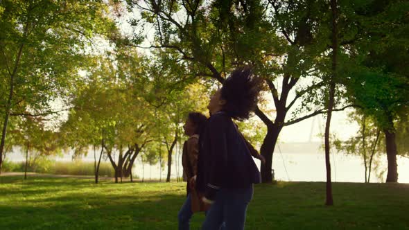 Happy Parents Kid Walking Autumn City Garden Holding Hands Together Side View