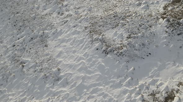 Snowy mountain landscape, aerial view of mountains at sunset near Didgori. Nichbisi. Georgia 2021