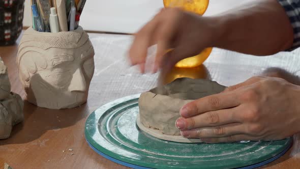 Ceramics Artist Shaping Clay, Creating a Bowl at His Workshop