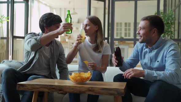 Three Friends Talk To Each Other and Eat Food at Home