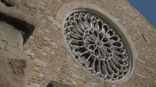 Close up on a rose window of an old cathedral. Trieste, Italy. Static view