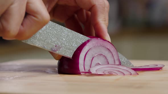 Onions On A Wooden Board On A Kitchen