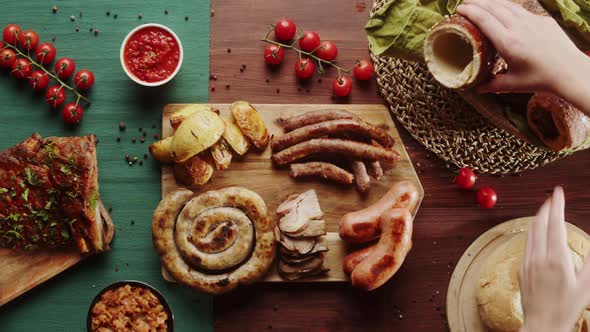 Eating Potato with Ketchup Sauce and Taking Trdelnik Top View