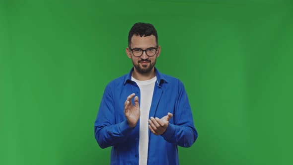 Portrait of Enthusiastic Young Man Clapping Hands Showing Appreciation Looking at Camera and