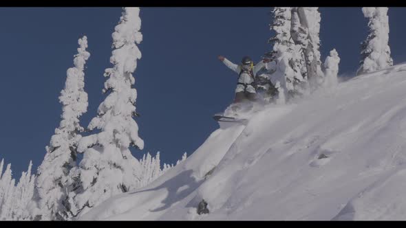 Snowboarder Going Off Small Jump